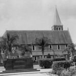 View of the Christ Church of England and the Bert Hinkler memorial in Buss Park, Bundaberg, 1948