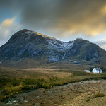 A wee house and a big mountain.
