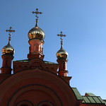 February 1, 2024. The 708th day of war in Ukraine. Fragment of an arch with a central domed cross and two side domes above the main gate of the Holy Protection Monastery - Holosiivsky Desert. Kyiv.
