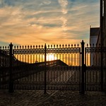 sunset behind bars