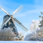 Old windmill in winter landscape