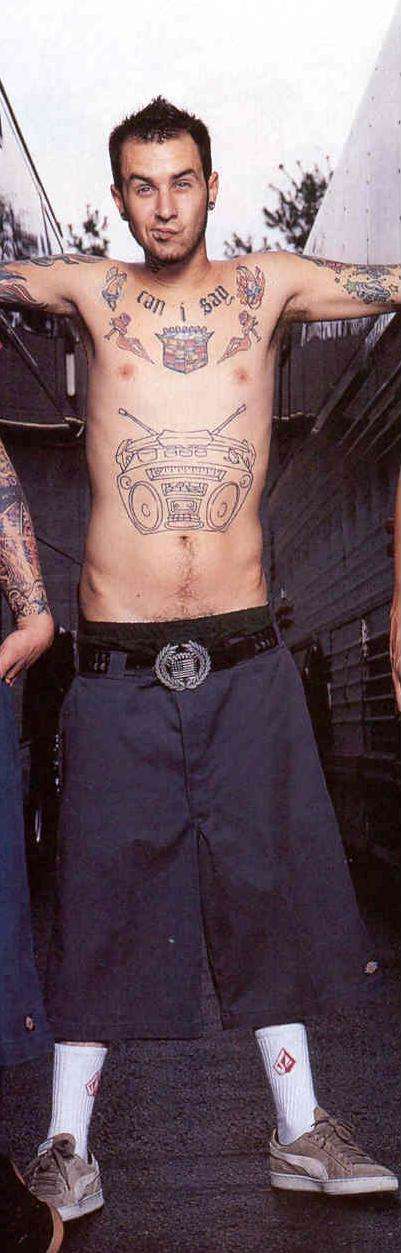 There is yet another post going around of them engaging in pda and fans are not having it. Travis Barker tattoo