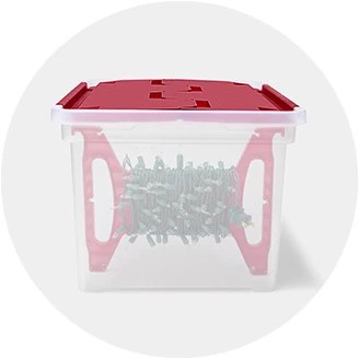 A christmas tree adorned with twinkling lights and ornaments is an essential holiday decoration. Christmas Storage Target