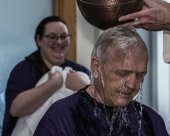 Keith Thompson of Salem, Ore., is baptized at Queen of Peace Church during the Easter Vigil April 3, 2021. Also pictured is Calli Hardwick-Wood, who also was baptized.