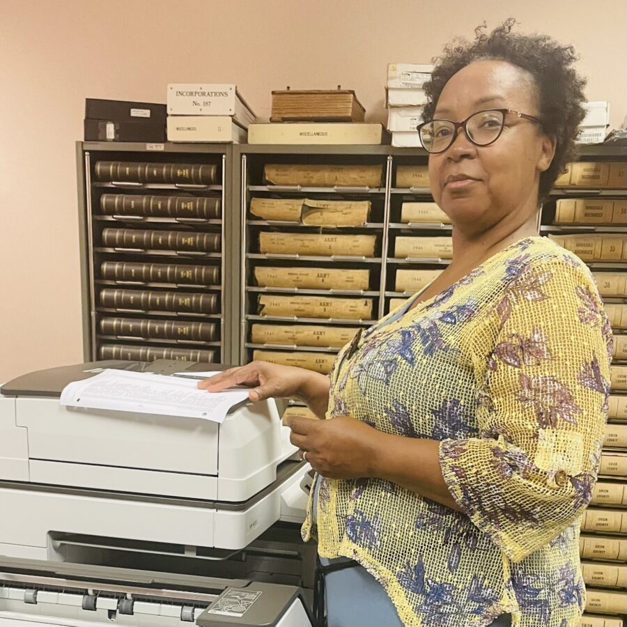 A woman using a copy machine