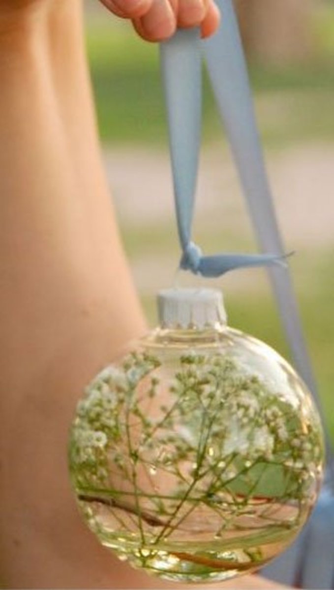 Floating flower hurricanes · 4. 18 DIY Wedding Decorations on a Budget | Holidappy