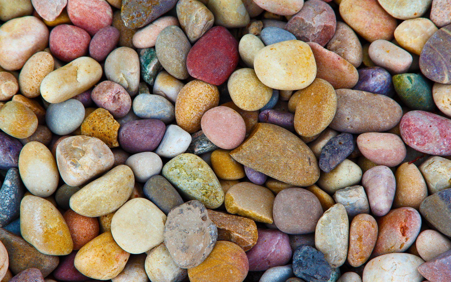 Multi coloured pebble stone wallpaper design creates the appearance of a colourful stone wall in complimentary tones of green, red, brown, yellow, . Pebble Wallpapers Top Free Pebble Backgrounds Wallpaperaccess