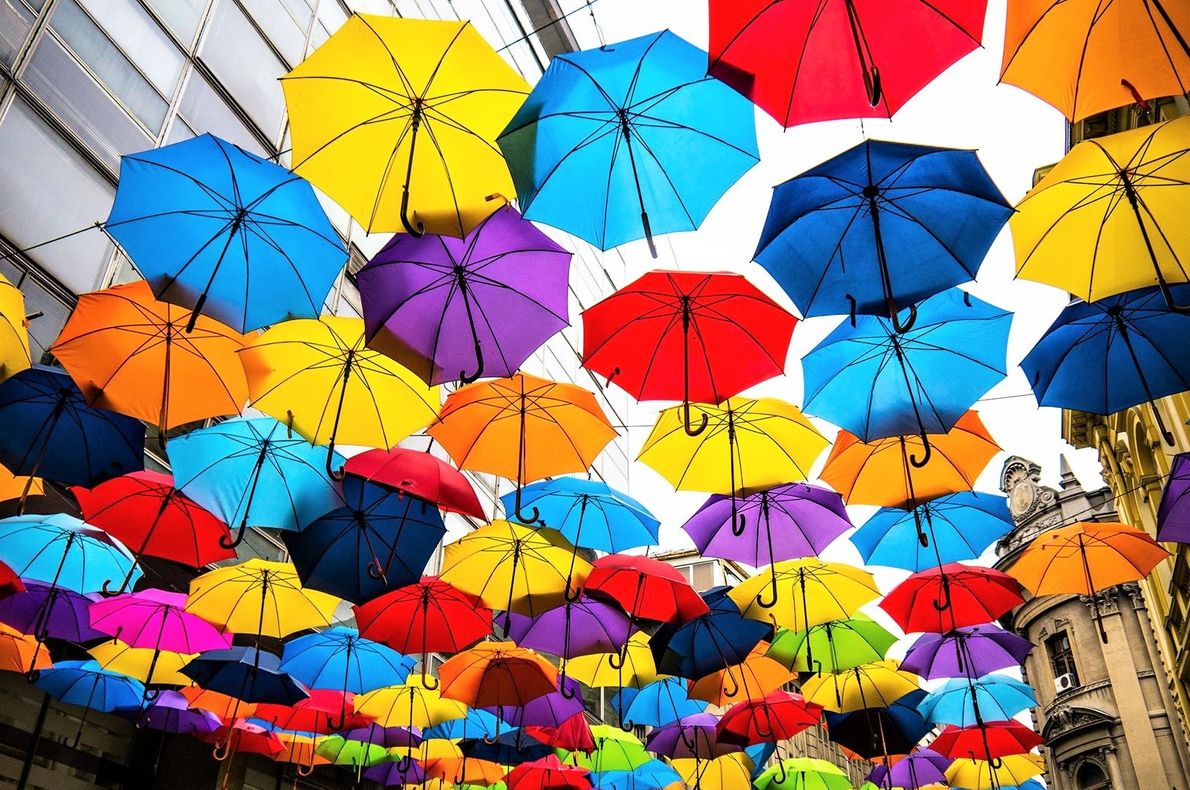 Social media marketers are a in state of constant flux. Colorful Umbrellas Float Above the Streets of Agueda, Portugal