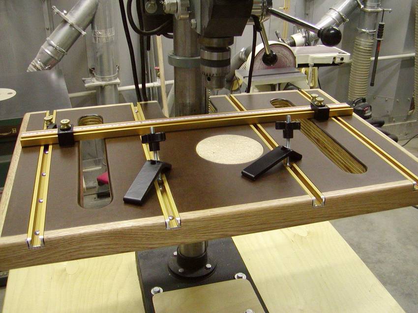 Lie on your back on a bench, feet flat on the floor. Drill press table
