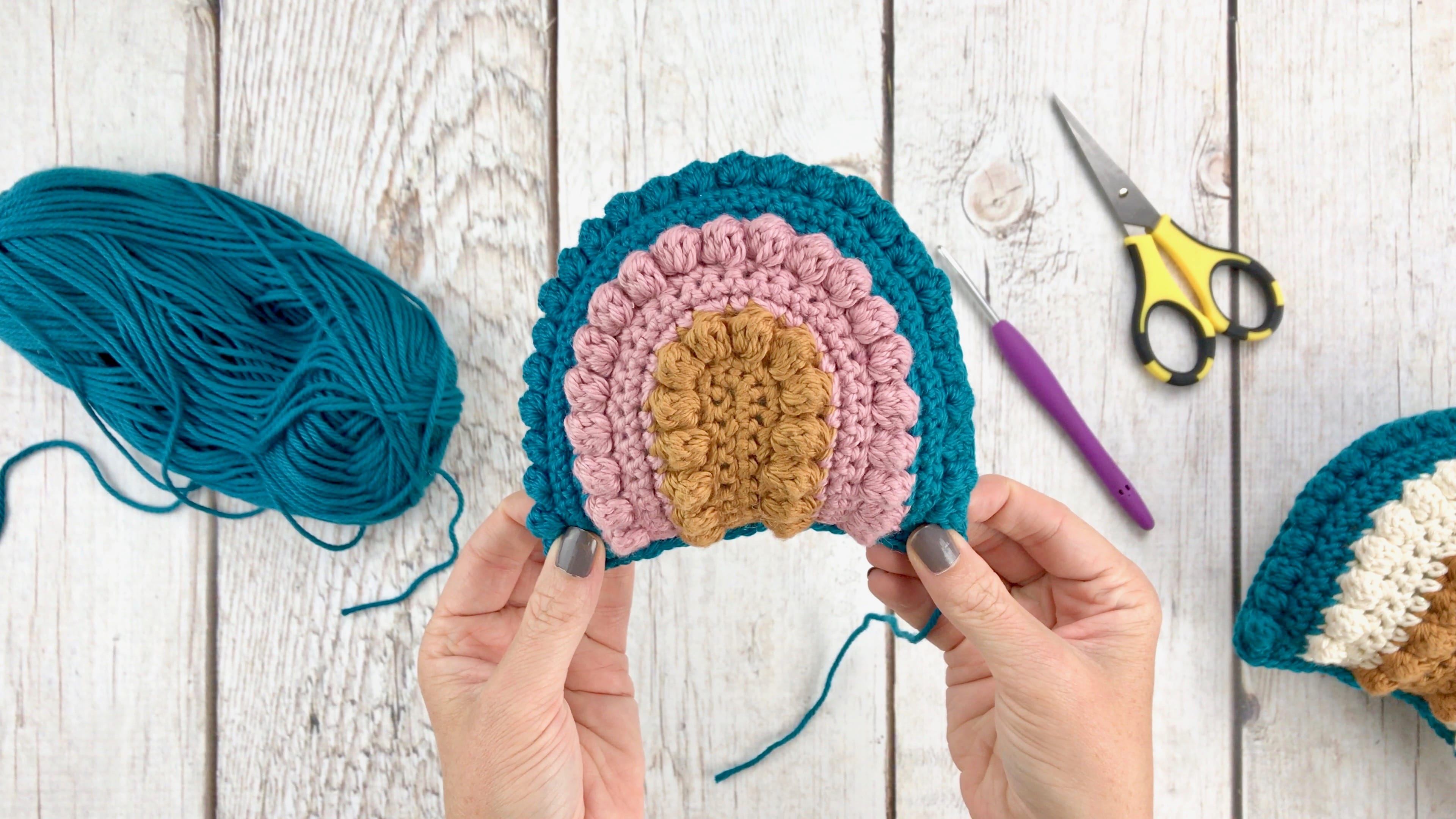 Fully photographed crochet pattern showing how make a crochet rainbow rattle. Includes a video tutorial, step by step photos and written instructions. 