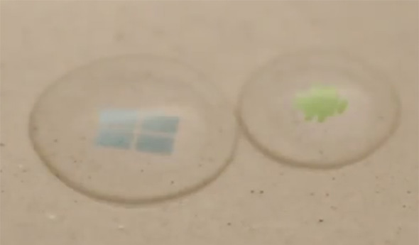 Windows und Android Logo in Wassertropfen. Foto: youtube.