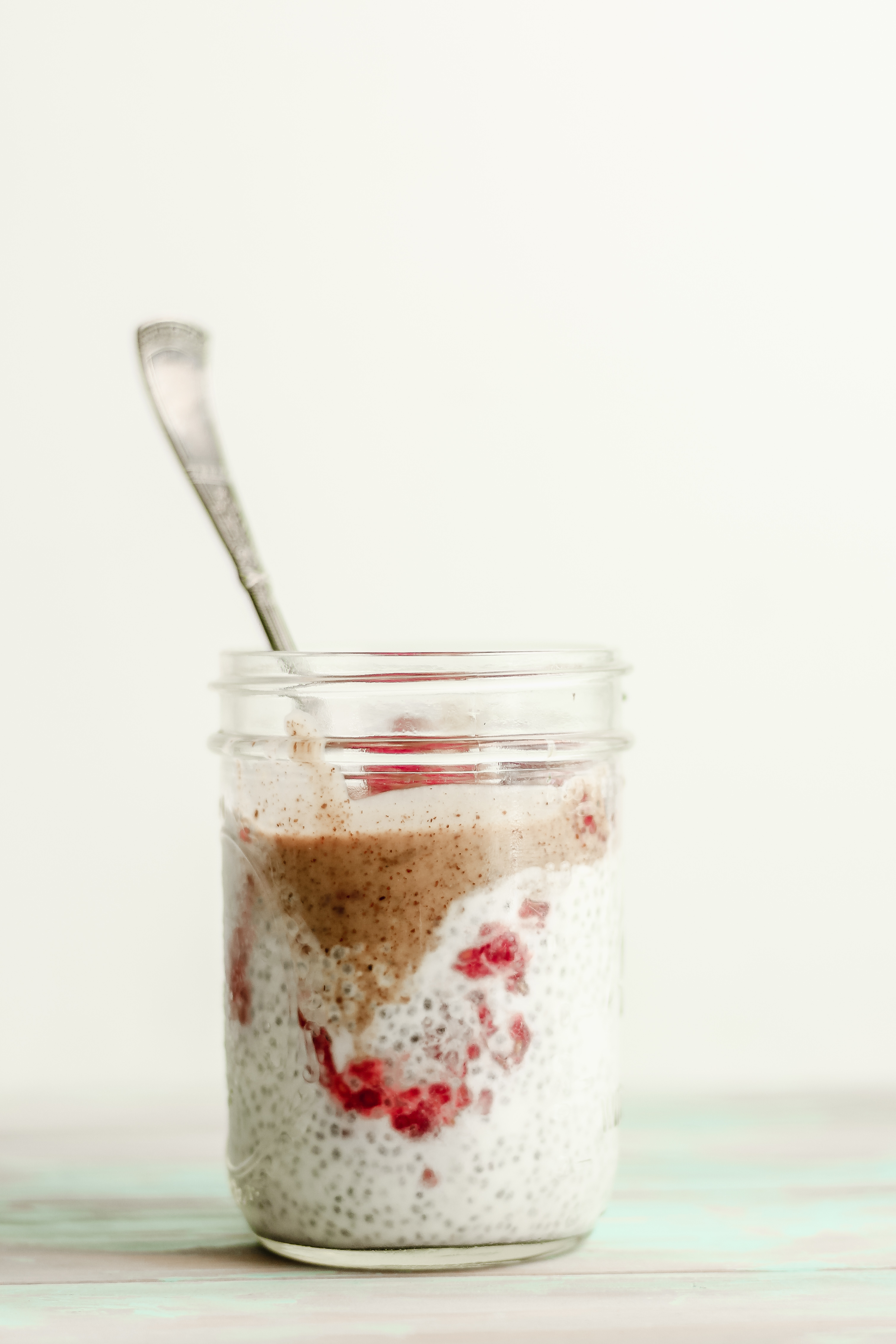 Raspberry Chia Pudding with Maple Almond Butter Sauce Baked Greens