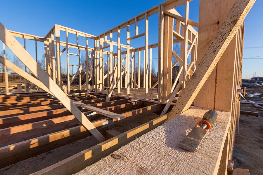New residential construction of wooden frame house.