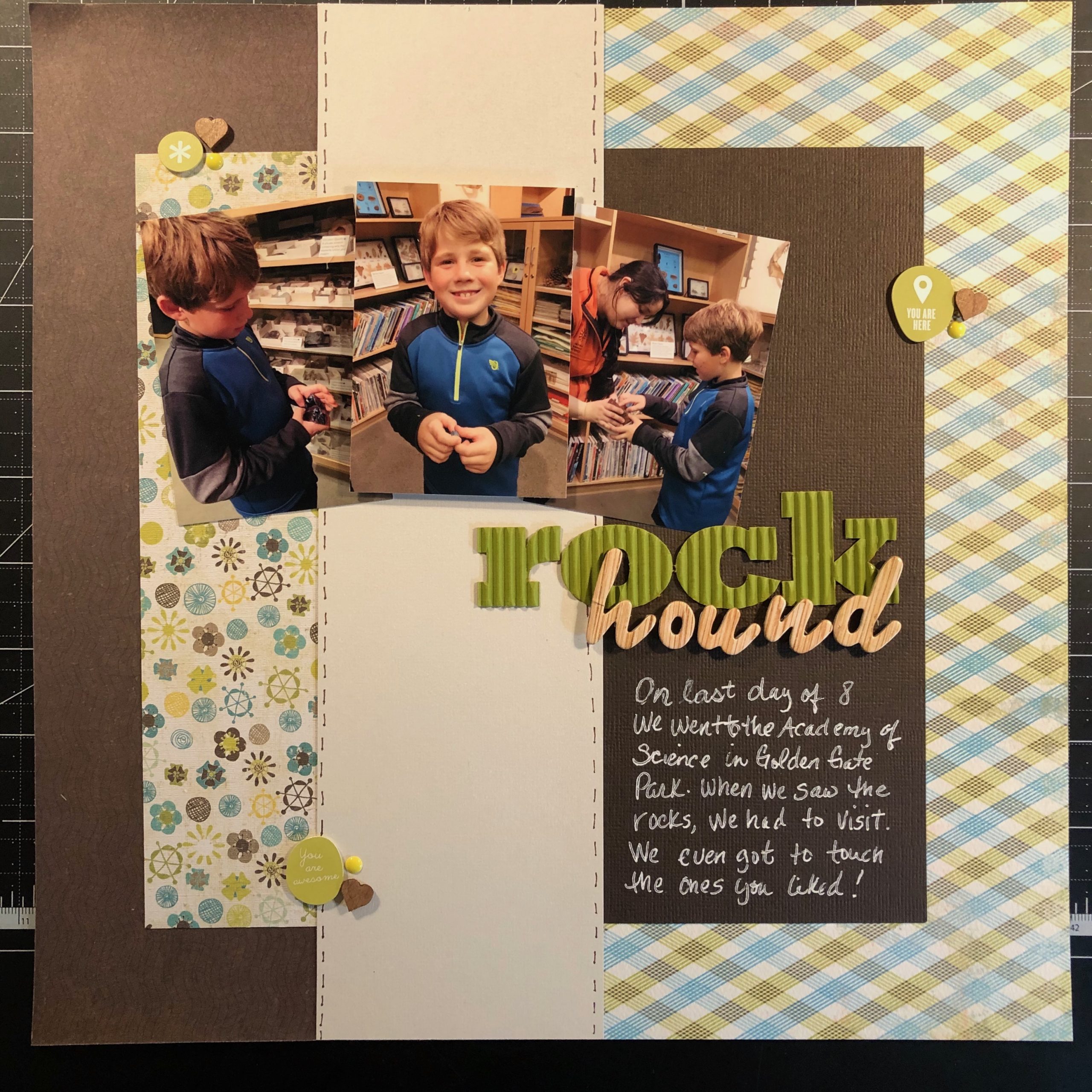 Scrapbook layout of Sean holding rocks.