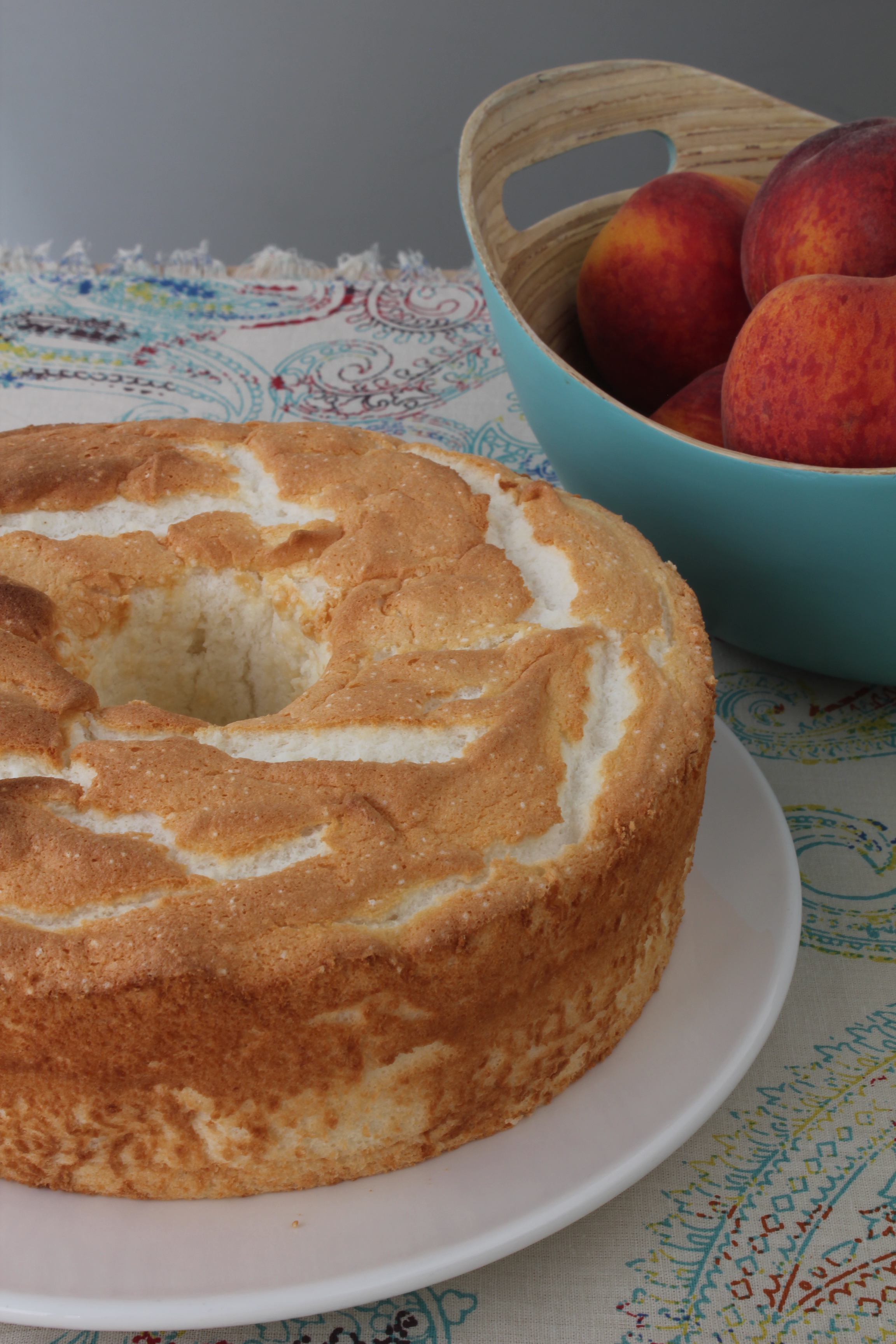 There were several years that we made them from scratch using an emeril lagasse recipe from a fancy cajun cookbook…and waited up half the night . Angel Food Cake with Marinated Peaches | Emerils.com