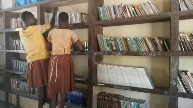 Kopeyia students helping to straighten up the library