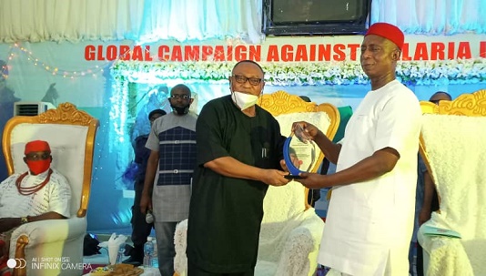 Prince Ned Nwoko receiving the 'Distinguished Service Award' from DELSU's VC, Prof. Egwunyenga on Saturday