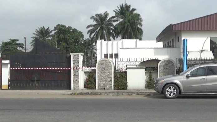 Front view of Delta Medical Doctors Commence Indefinite Strike Over Kidnap Of Maxin Lotus Hotel wrongfully sealed by a bailiff of Effurun High Court opposite the popular College