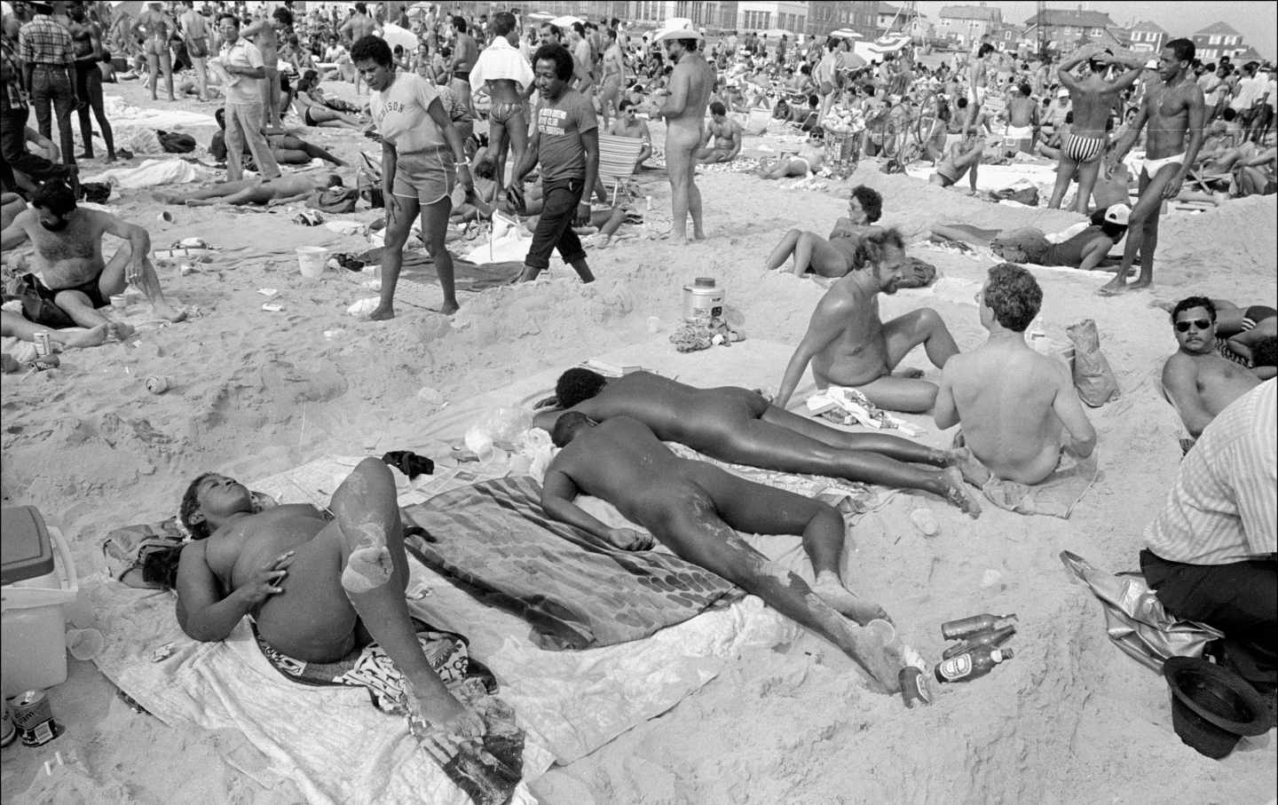 View of nude sunbathers on the beach at Jacob Riis Park in the Rockaways, New York, New York, August 1, 1982.