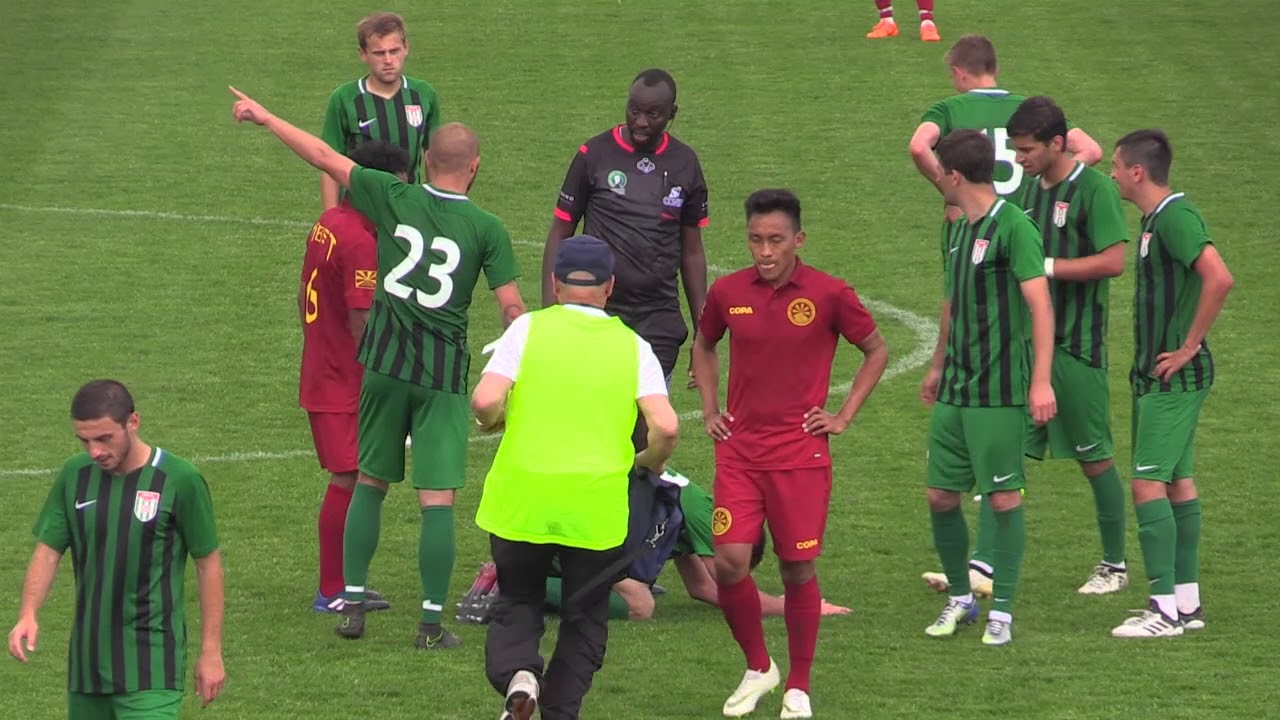 Abkhazian players dispute the referee's decision versus a CONIFA game against Tibet. 