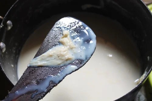 mix milk solids into the milk