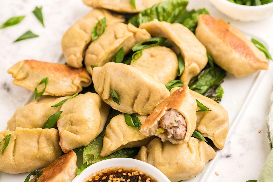 Gluten free potstickers on a plate.