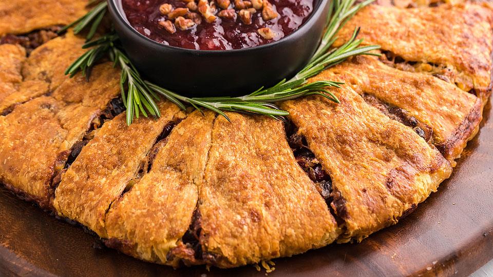Food blogger, Bella Bucchiotti of xoxoBella, shares a recipe for a pineapple cranberry brie crescent ring appetizer. You will love this Christmas wreath.