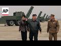North Korea's Kim Jong Un observes rocket launch systems test with daughter