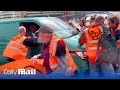Van driver ploughs through Just Stop Oil protesters in London