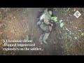 Moment Russian soldier catches and throws away Ukrainian 'drone bombs'.