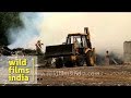 Firemen struggle to control fire at a garbage dump in Delhi