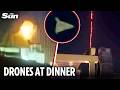 Shocking moment Iranian drones fly low over restaurant as US air defences shoot down Shaheds