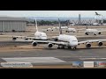 Close-up departures at London Heathrow Airport, rwy 27R Ft Double stack A380 departure at 01:24:30