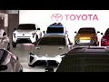 Toyota cuts output target as profits tumble