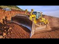 Bulldozer Clearing Massive Rock and Soil on Mountain Road