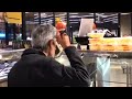 Man Sips Soup From Ladle at Chicago Supermarket Buffet